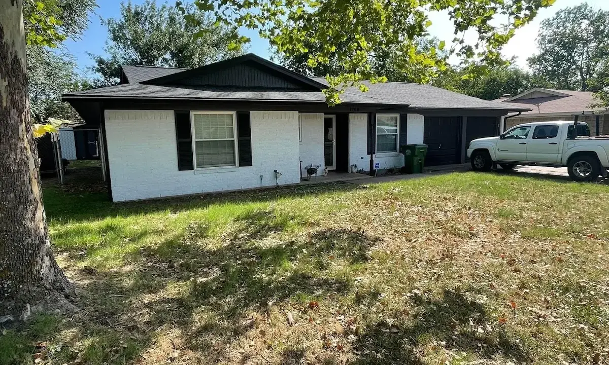 Professional roofing crew working on a residential roof in Herndon